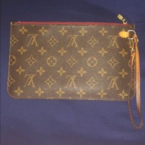 Louis Vuitton clutch.